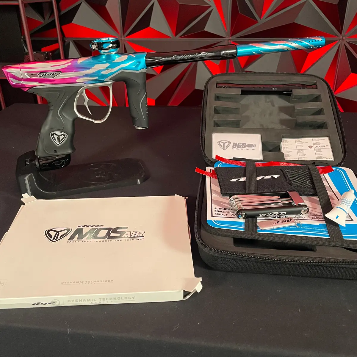 Used Dye M3+ Paintball Gun - Tiger Royalty (Pink & Cyan) W/ Mosair Charging Pad 1