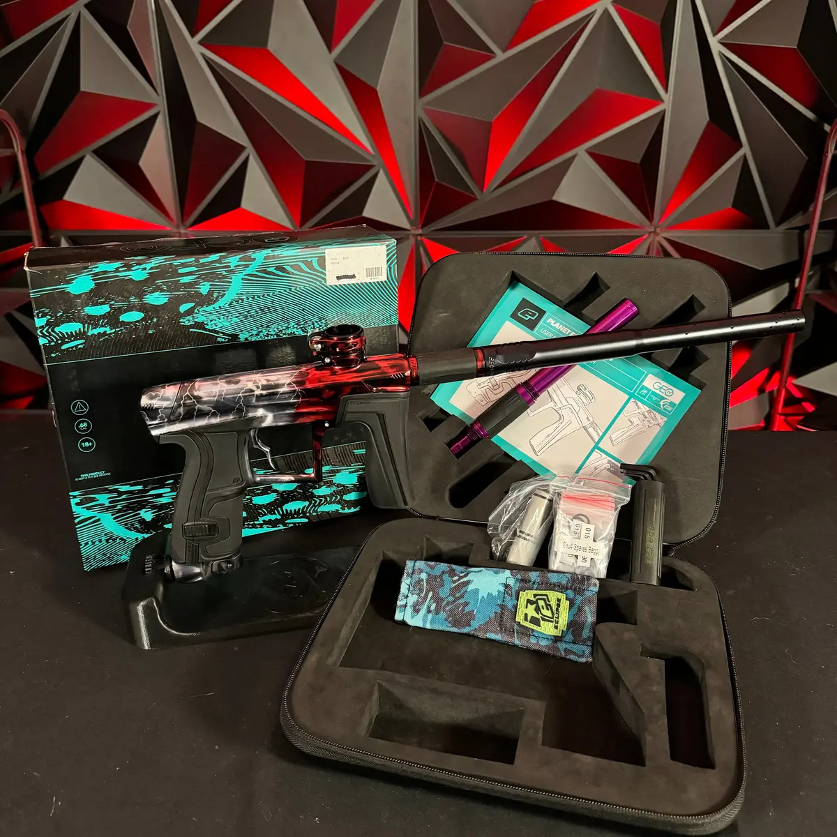 Used Planet Eclipse Geo 4 Paintball Gun - Silver/Red Acid Wash Fade W/Lightning Bolts, Infamous Trigger 1