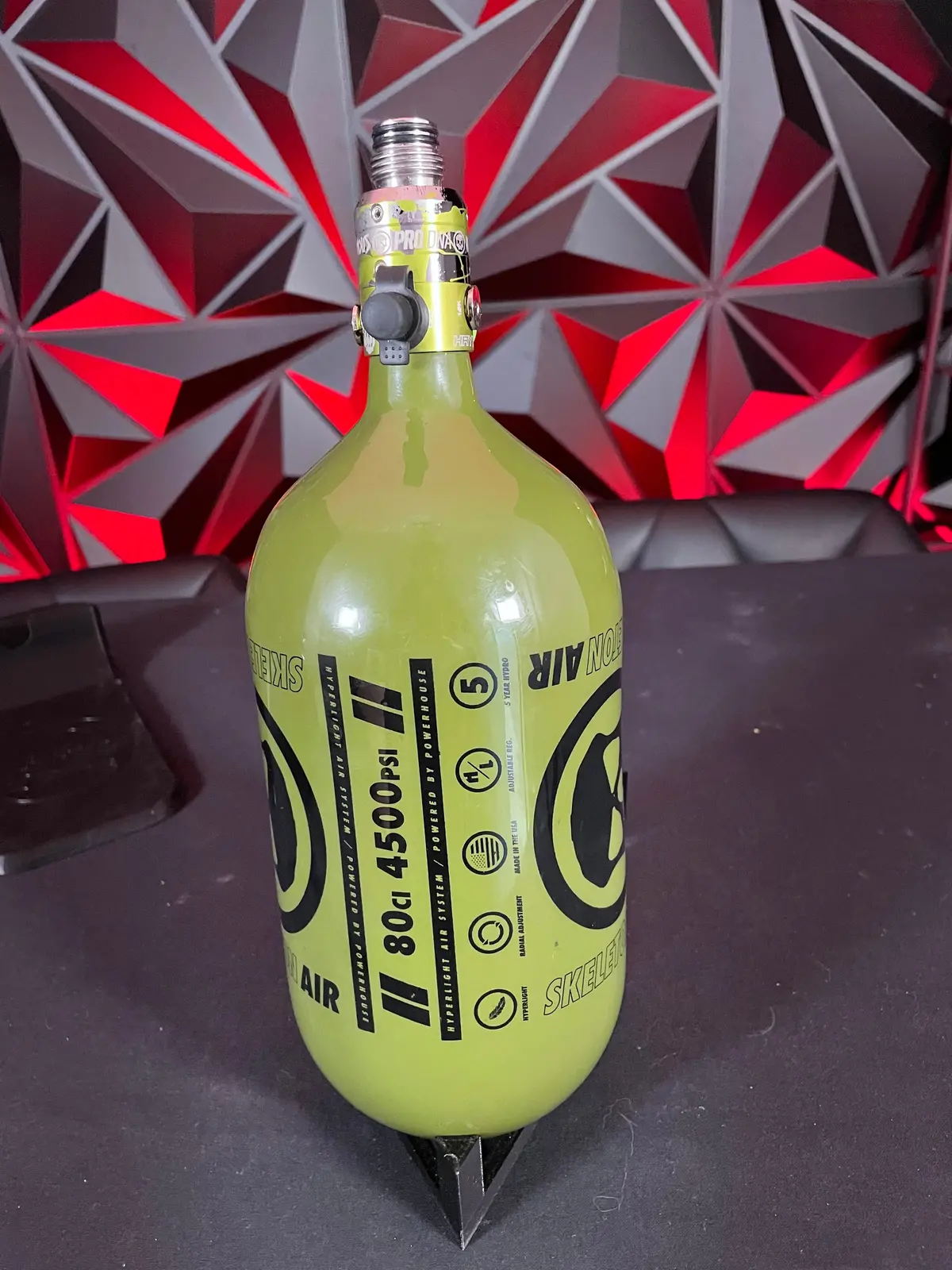 Used Infamous "Skeleton Air" Hyperlight 80/4500 Paintball Tank - Olive W/ Green Splash Haymkr Reg 1