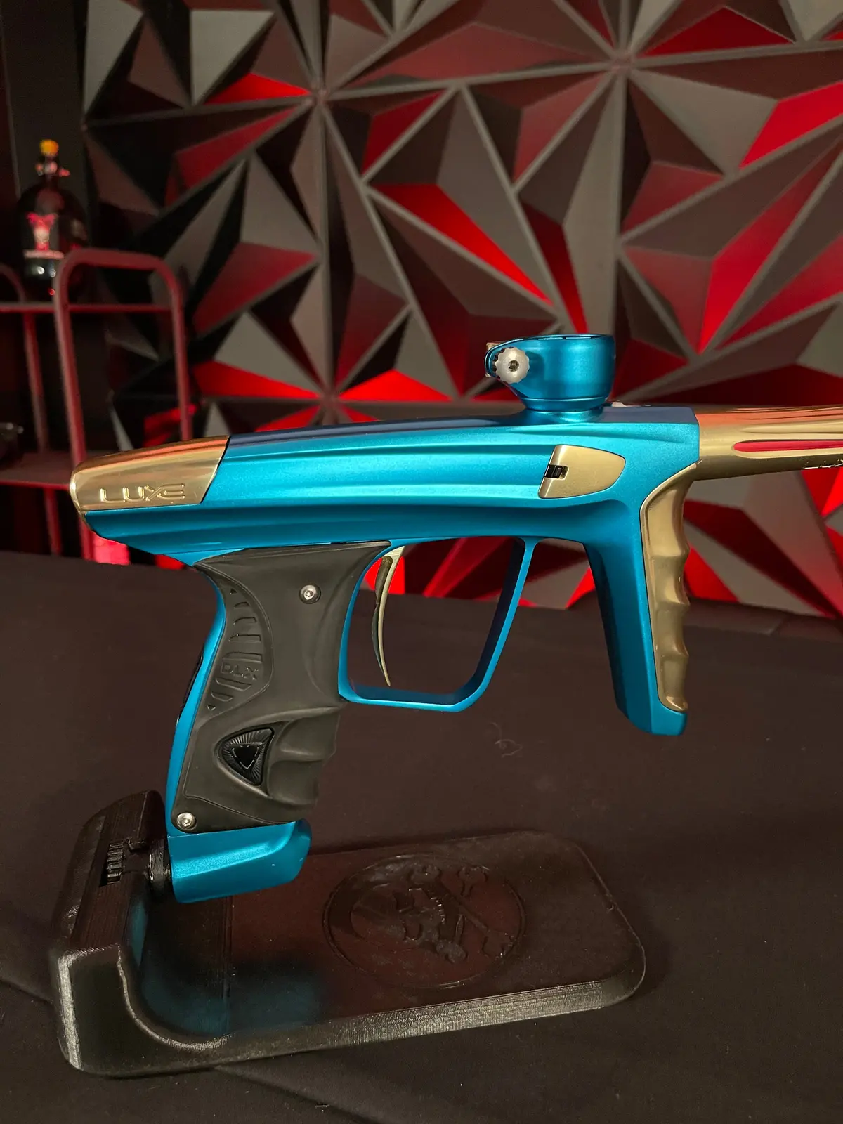Used Dlx Luxe X Paintball Gun - Dust Teal / Polished Gold 1