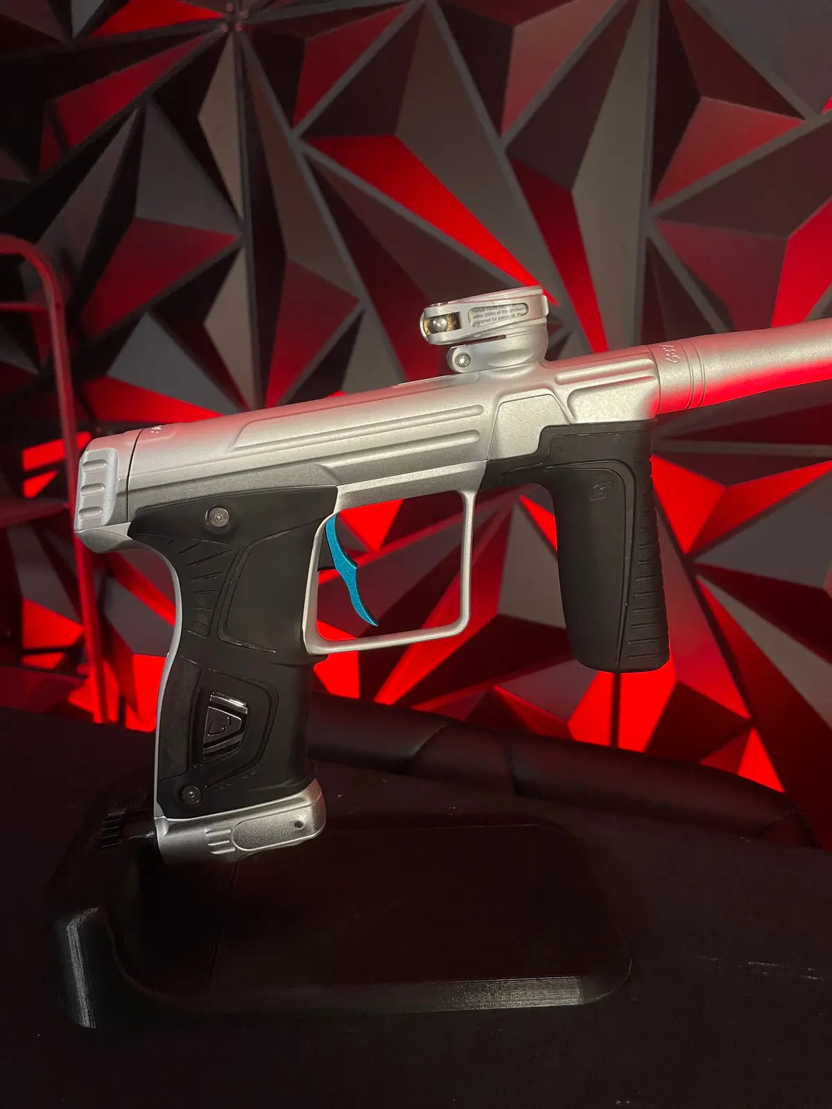 Used Planet Eclipse 170R Paintball Gun - Silver W/ Teal Deuce Trigger 1