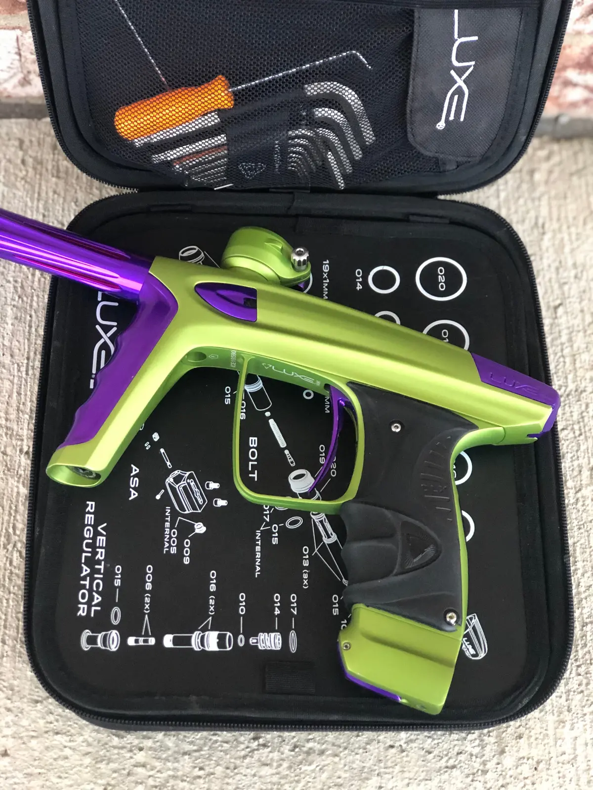 Used Dlx Luxe Ice Paintball Gun - Dust Green W/ Purple 1