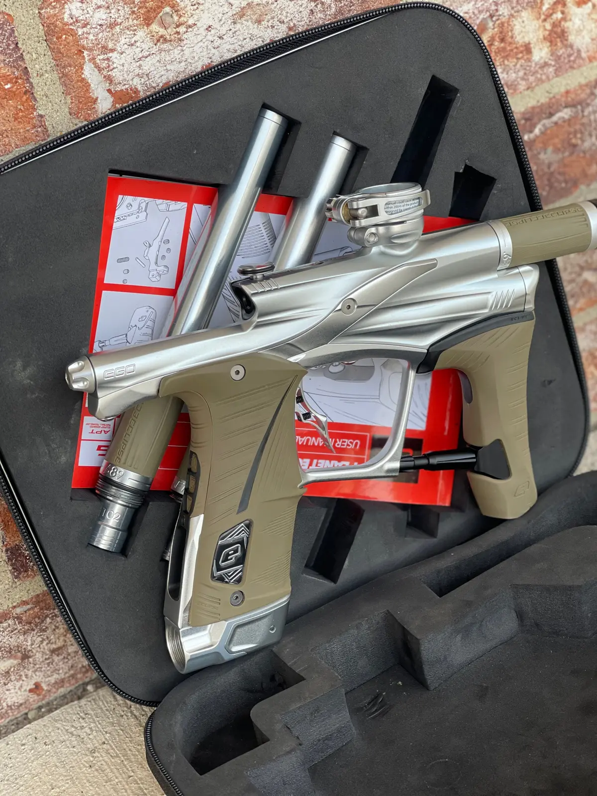 Used Planet Eclipse Lv1.6 Paintball Gun - Silver (Pure) W/ Tan Grips, 3 Fl Inserts, And Infamous Deuce Trigger 1