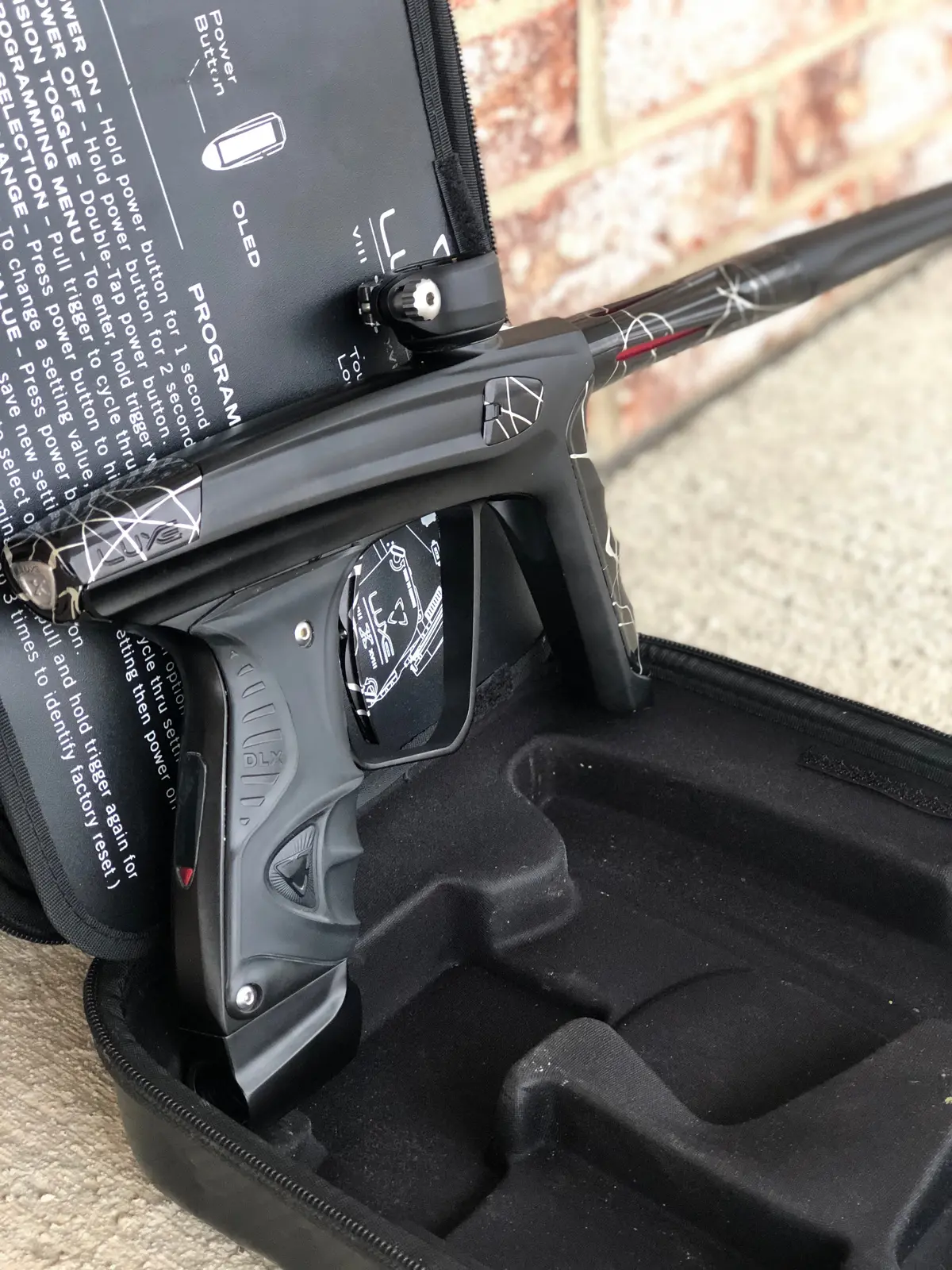 Used Dlx Luxe X Paintball Gun - Dust Black W/ Black & Silver Splash Accents 1